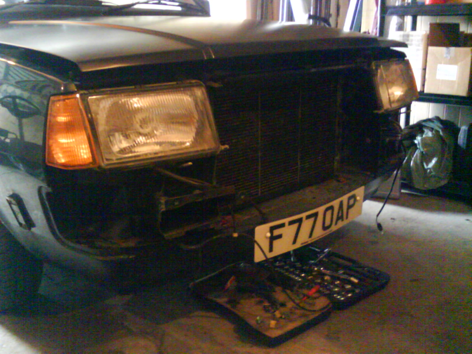 Front end stripped to remove headlight wipers...