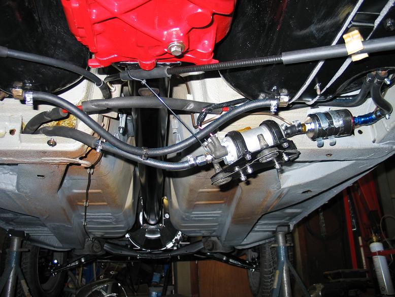 Fuel pump and pre-filter with new mount rubbers.  Big thanks to Mac for the handbrake clips.